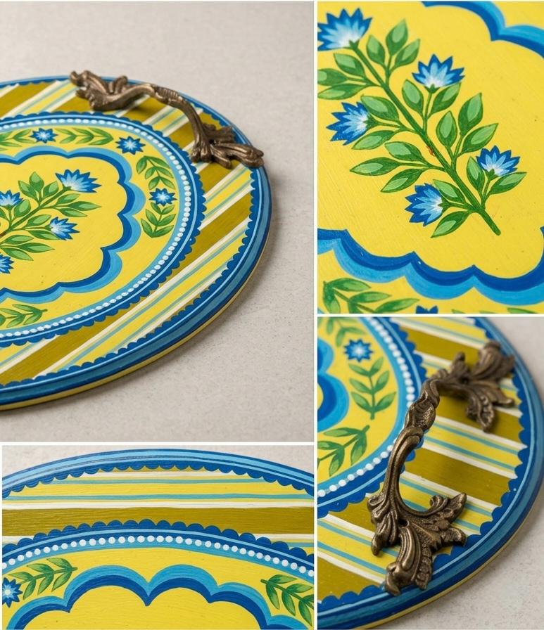 Detail crops of a yellow and blue round botanical tray with brass handles.